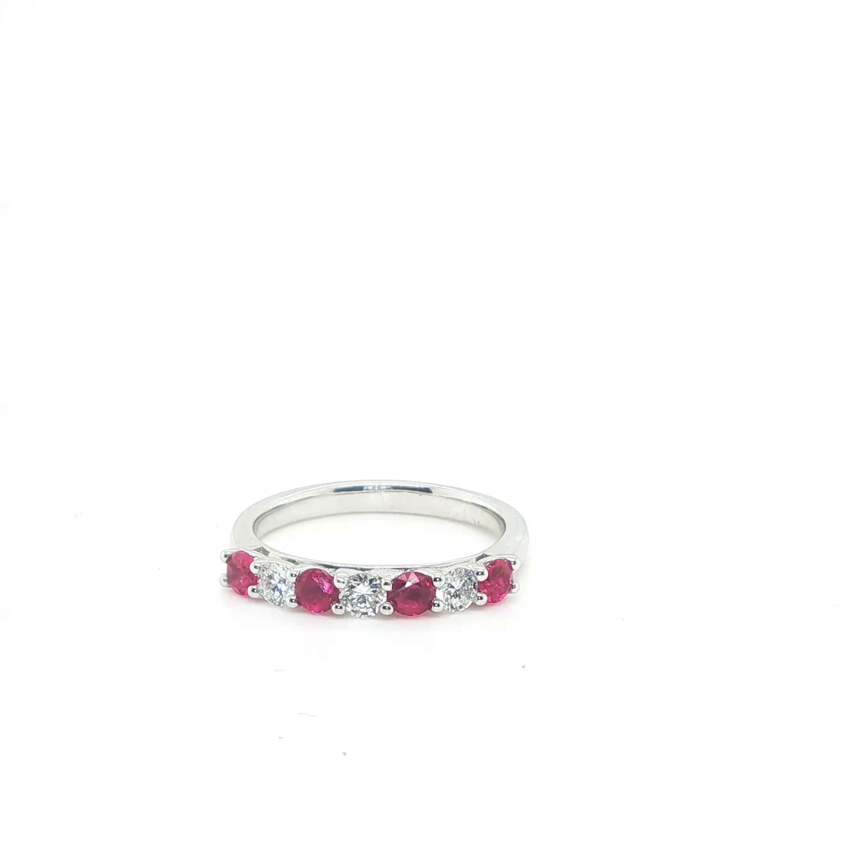 Three-Stone Round Brilliant Ruby and Diamond Ring in Polished White Gold