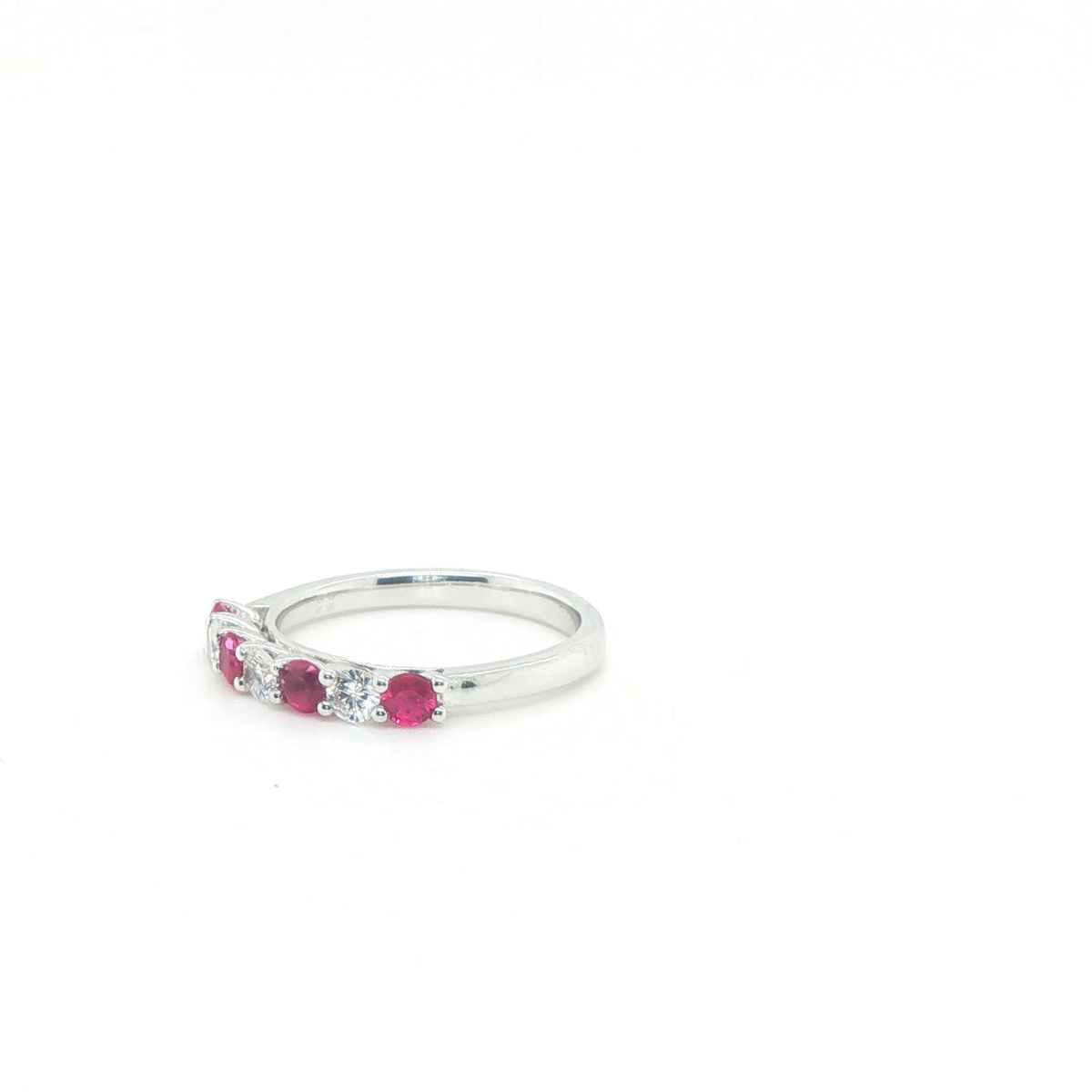 Three-Stone Round Brilliant Ruby and Diamond Ring in Polished White Gold