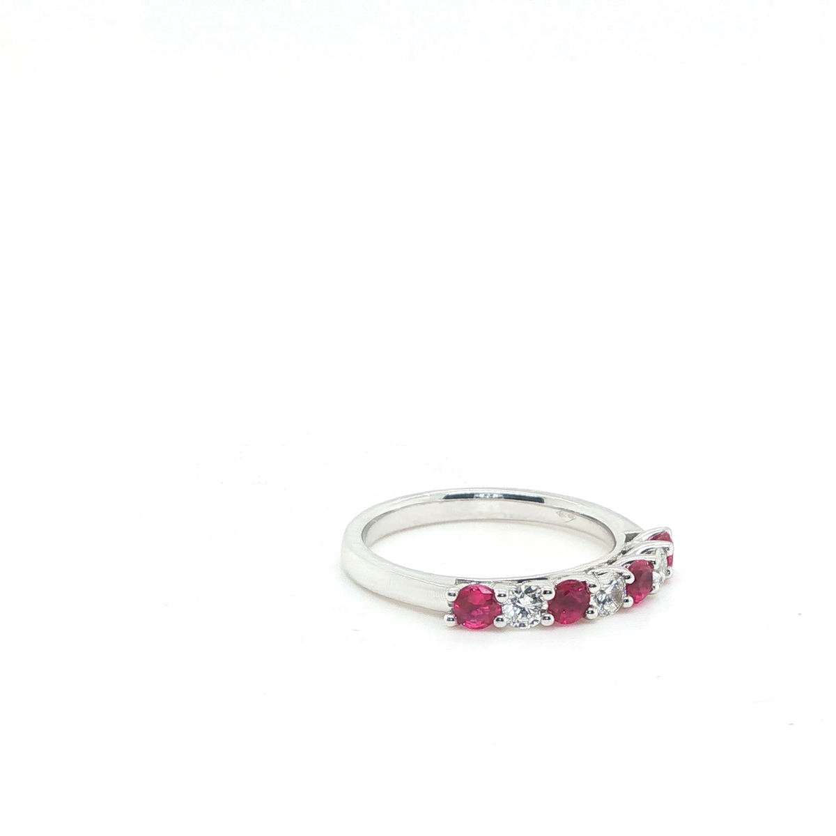 Three-Stone Round Brilliant Ruby and Diamond Ring in Polished White Gold