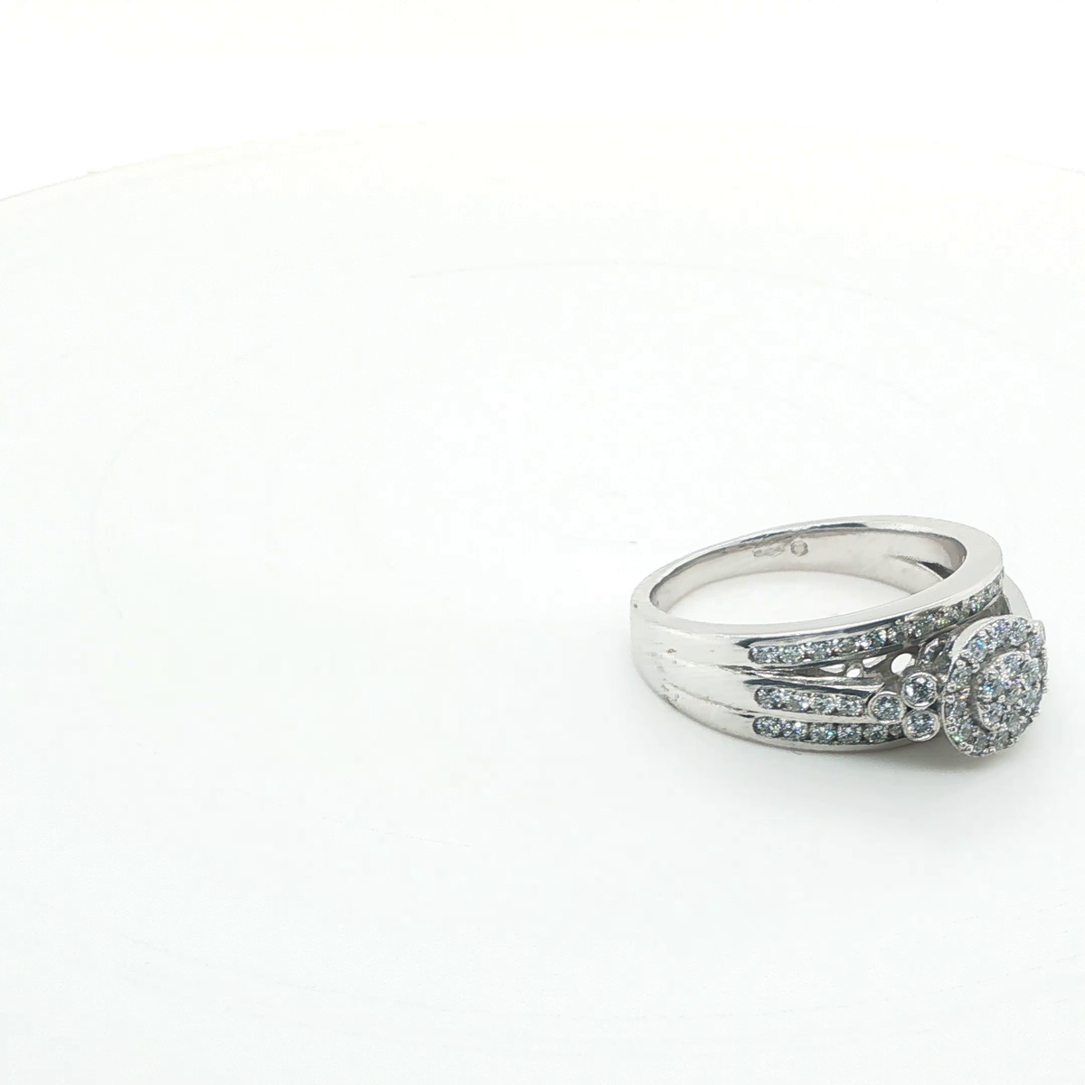 Round Brilliant Diamond Platinum Three-Stone Anniversary Ring with Pave Accents