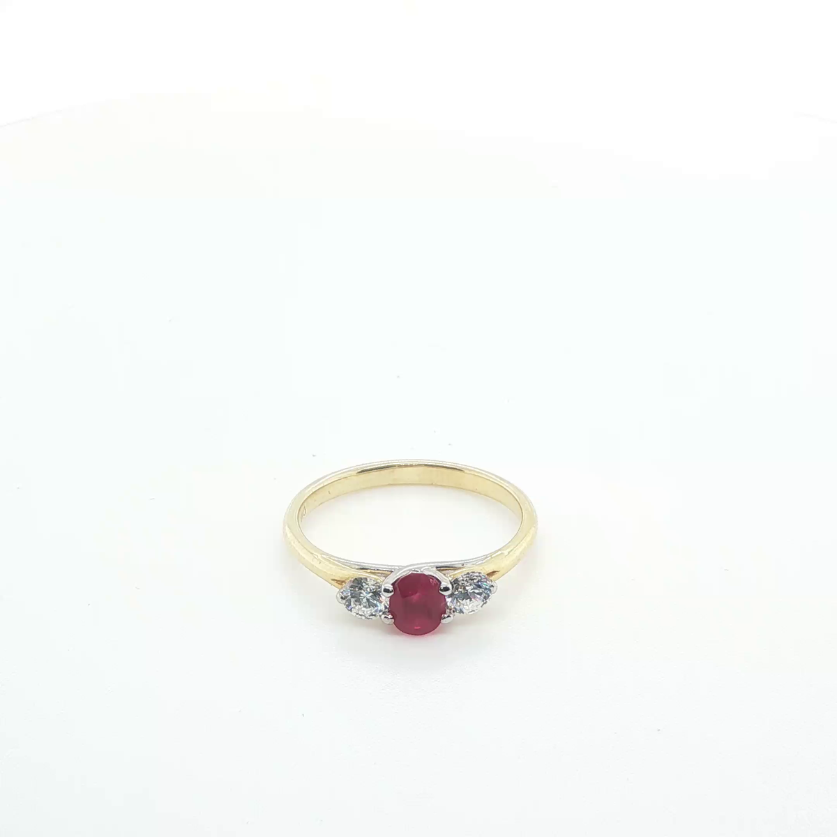 Oval Brilliant Cut Ruby Three-Stone Ring in Polished Yellow Gold