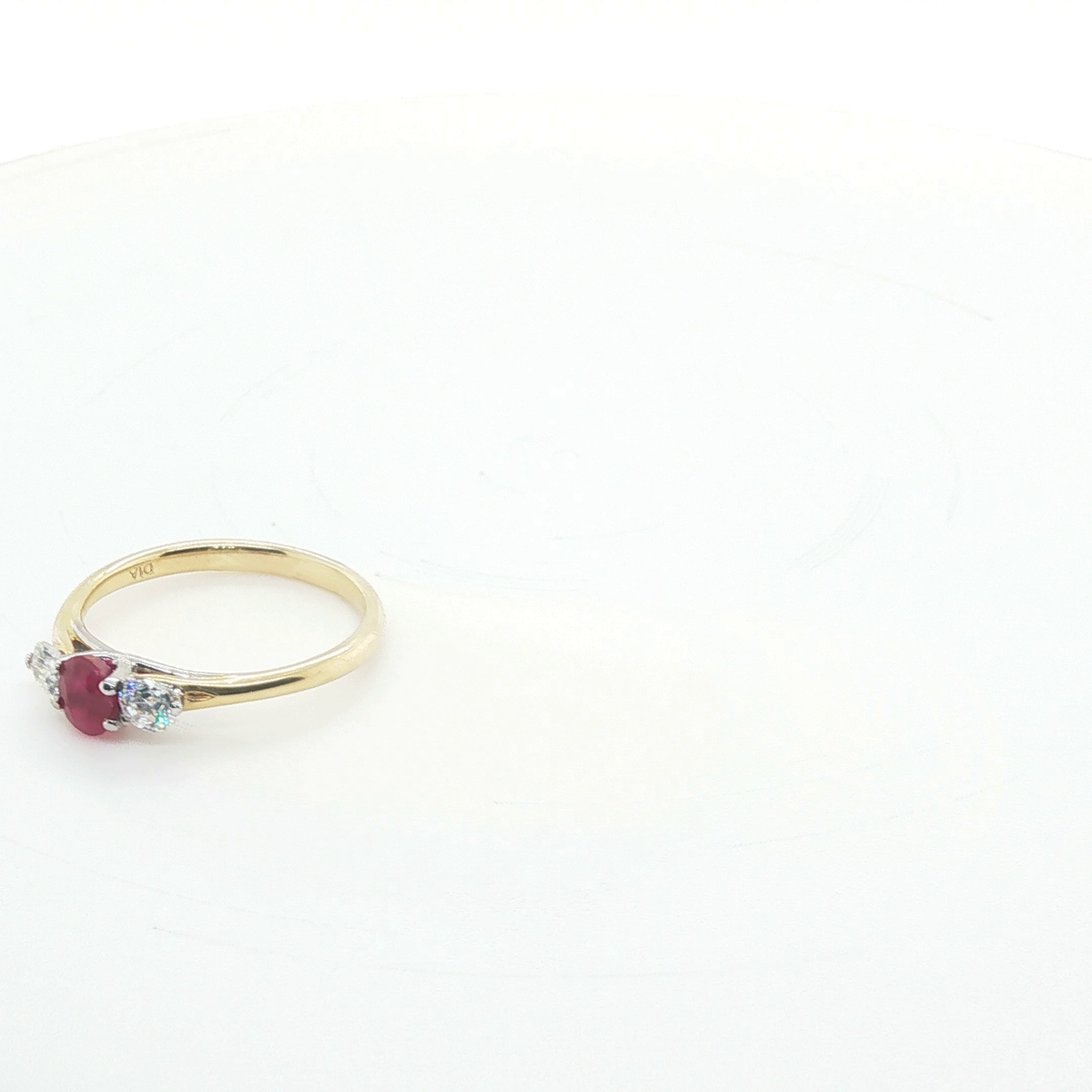 Oval Brilliant Cut Ruby Three-Stone Ring in Polished Yellow Gold