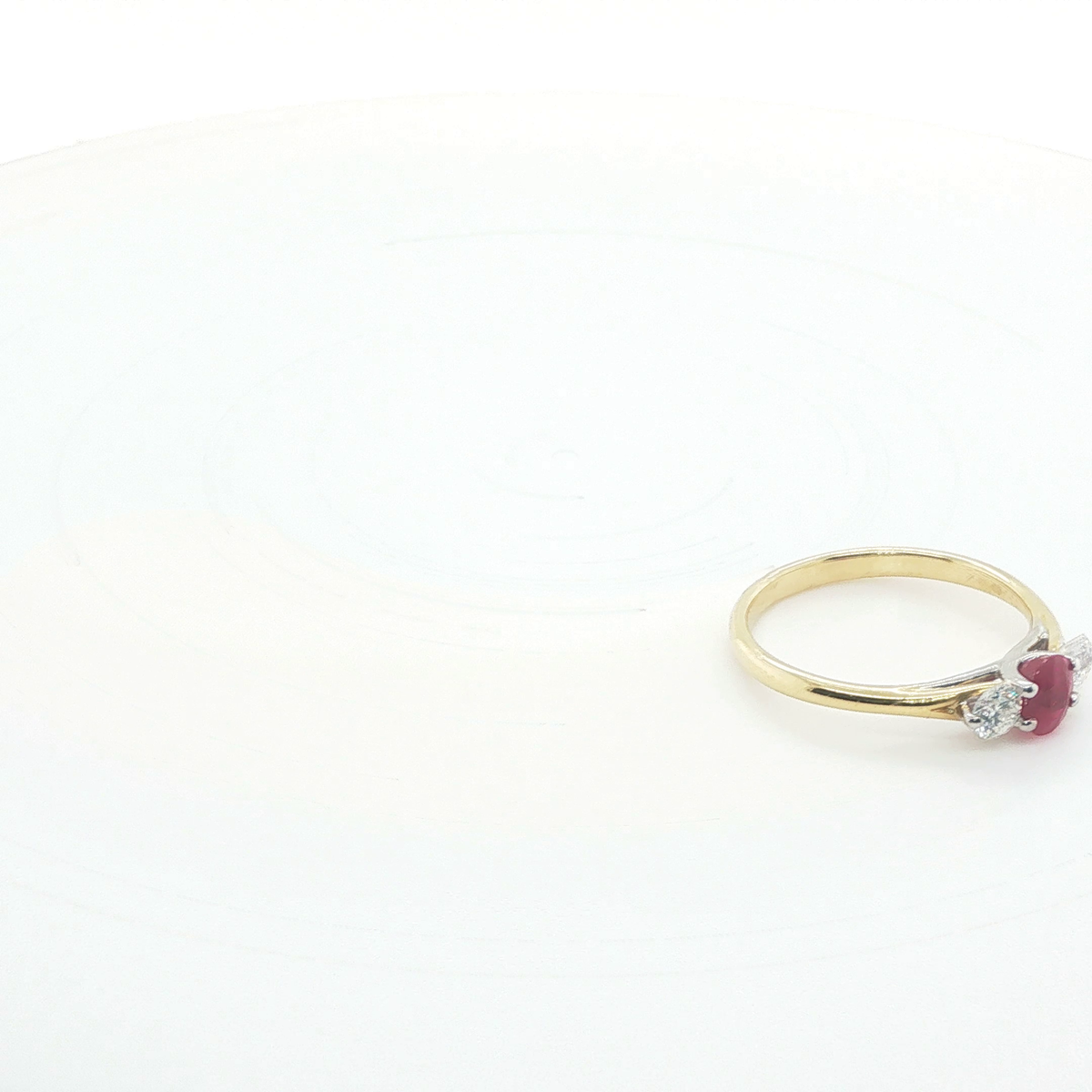 Oval Brilliant Cut Ruby Three-Stone Ring in Polished Yellow Gold