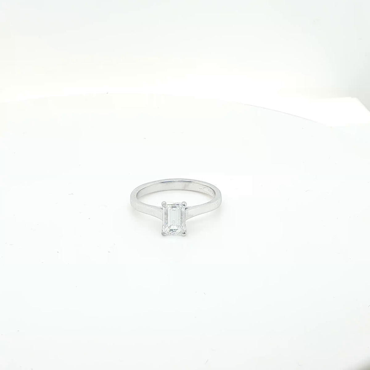 Elegant Emerald Cut Diamond Solitaire Ring in Polished Platinum