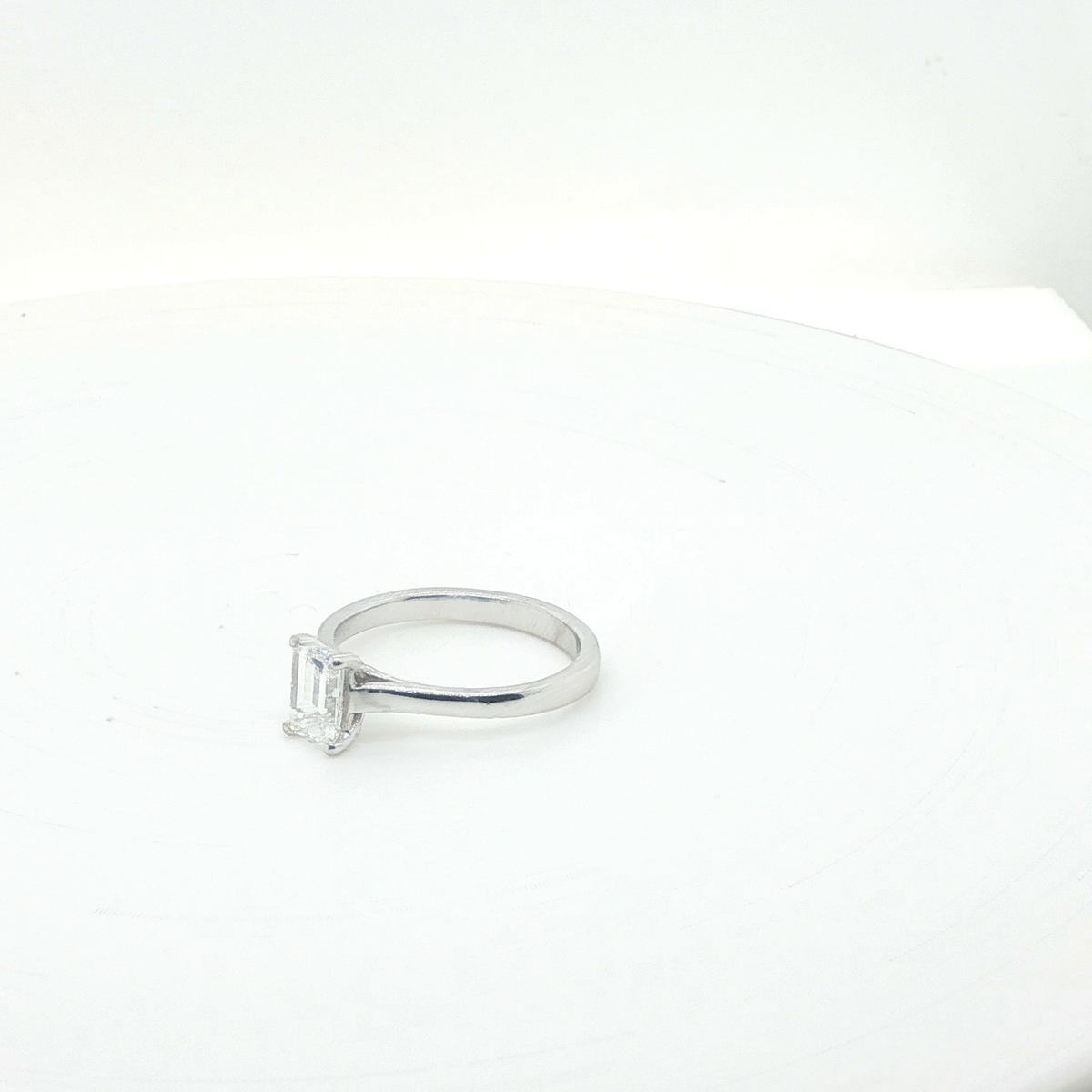 Elegant Emerald Cut Diamond Solitaire Ring in Polished Platinum