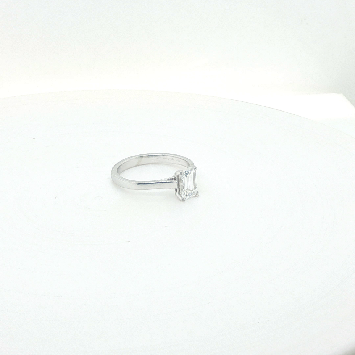 Elegant Emerald Cut Diamond Solitaire Ring in Polished Platinum