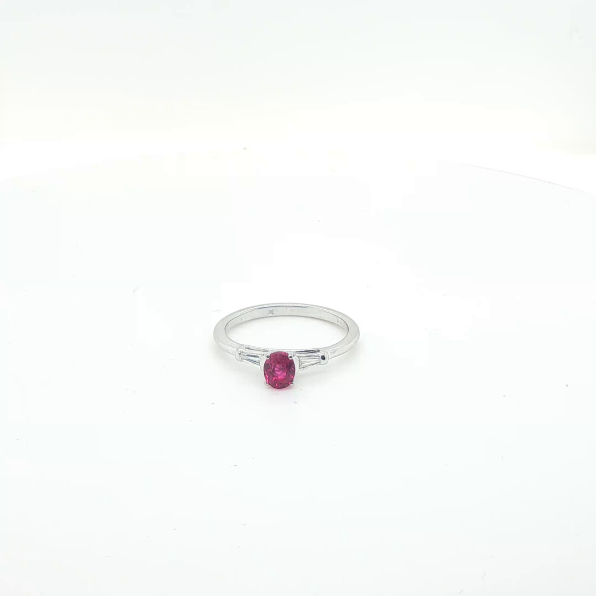 Oval Pink Sapphire and Diamond Halo Ring in 18ct White Gold