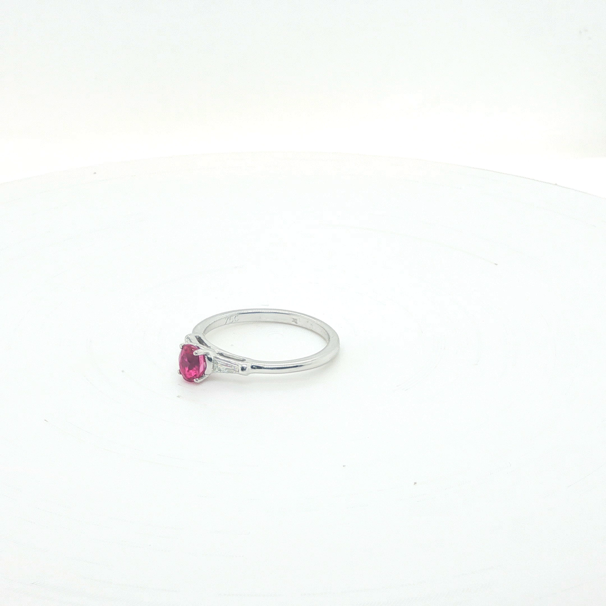 Oval Pink Sapphire and Diamond Halo Ring in 18ct White Gold