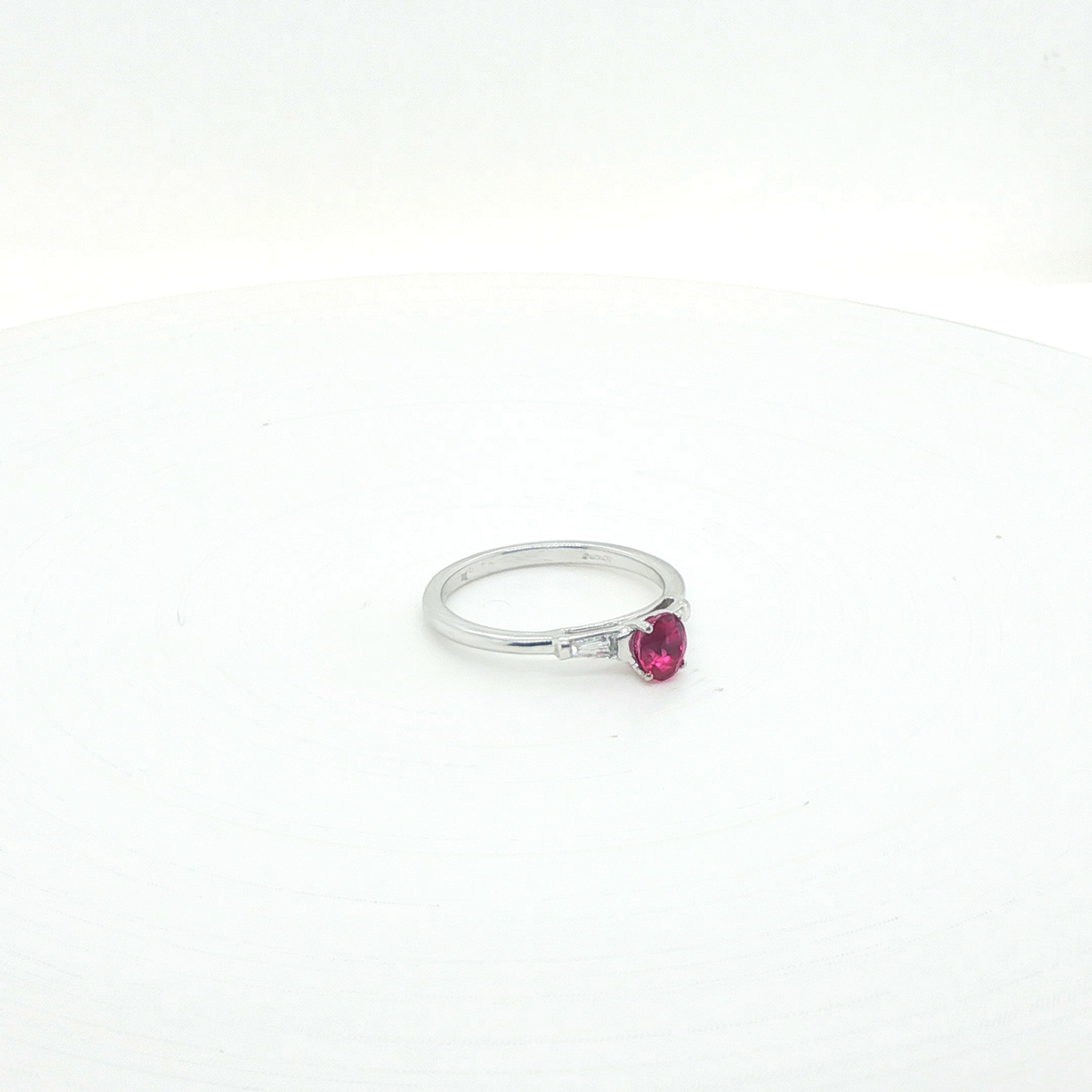 Oval Pink Sapphire and Diamond Halo Ring in 18ct White Gold