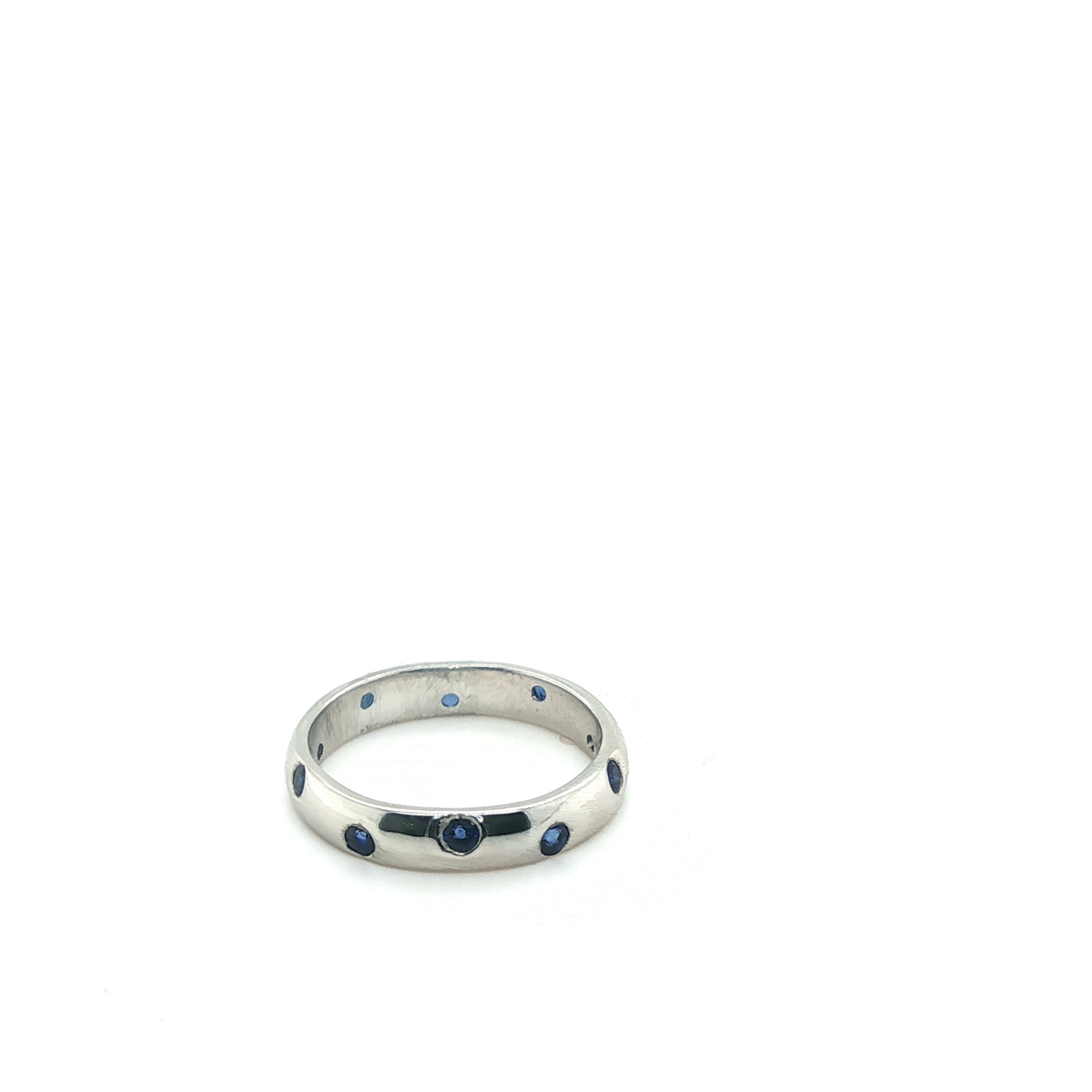 Round Brilliant Cut Blue Sapphire Eternity Ring in Platinum