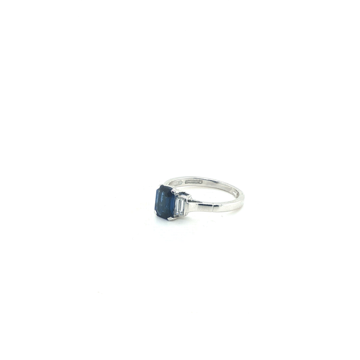 Emerald-Cut Blue Sapphire and Baguette Diamond Three-Stone Ring in White Gold