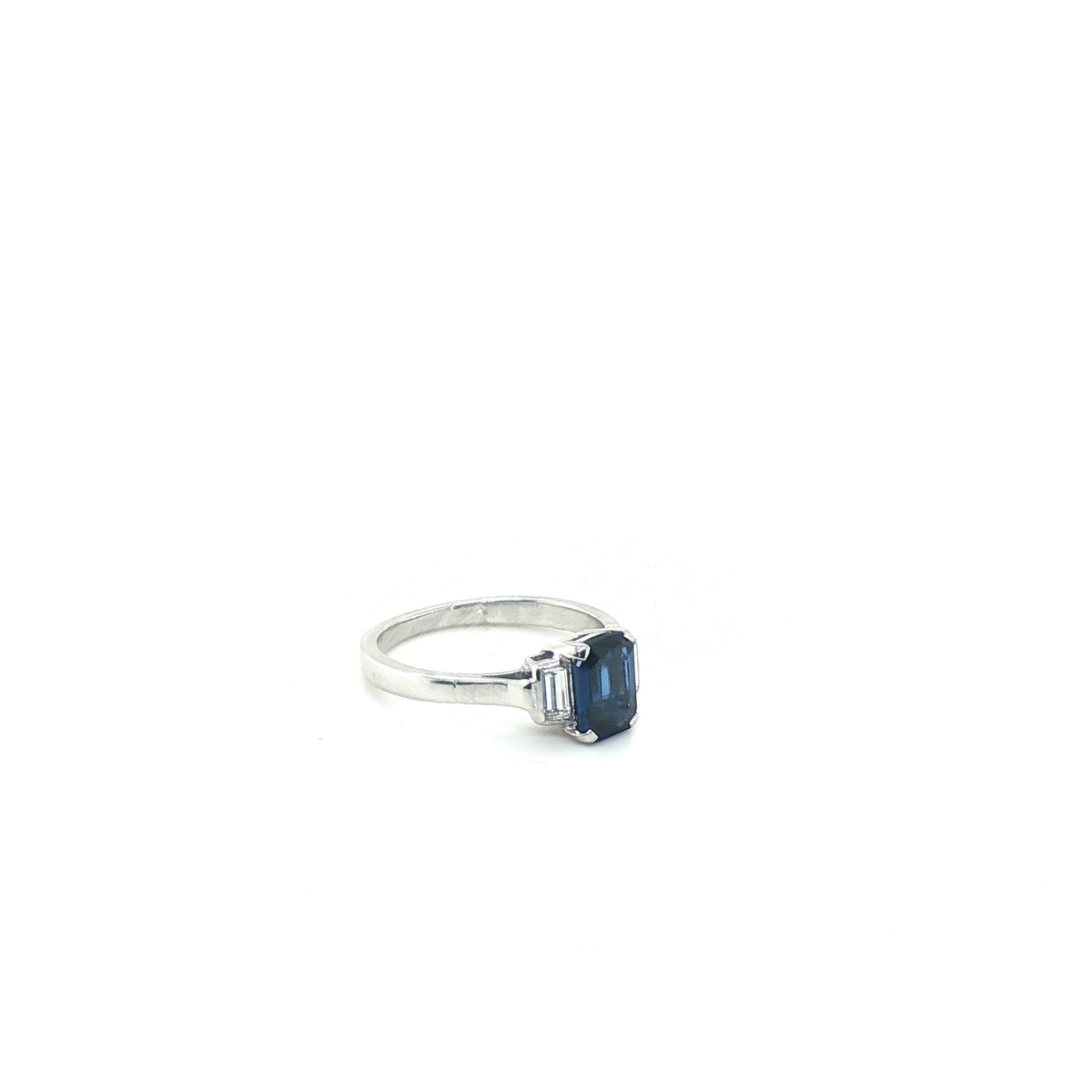 Emerald-Cut Blue Sapphire and Baguette Diamond Three-Stone Ring in White Gold