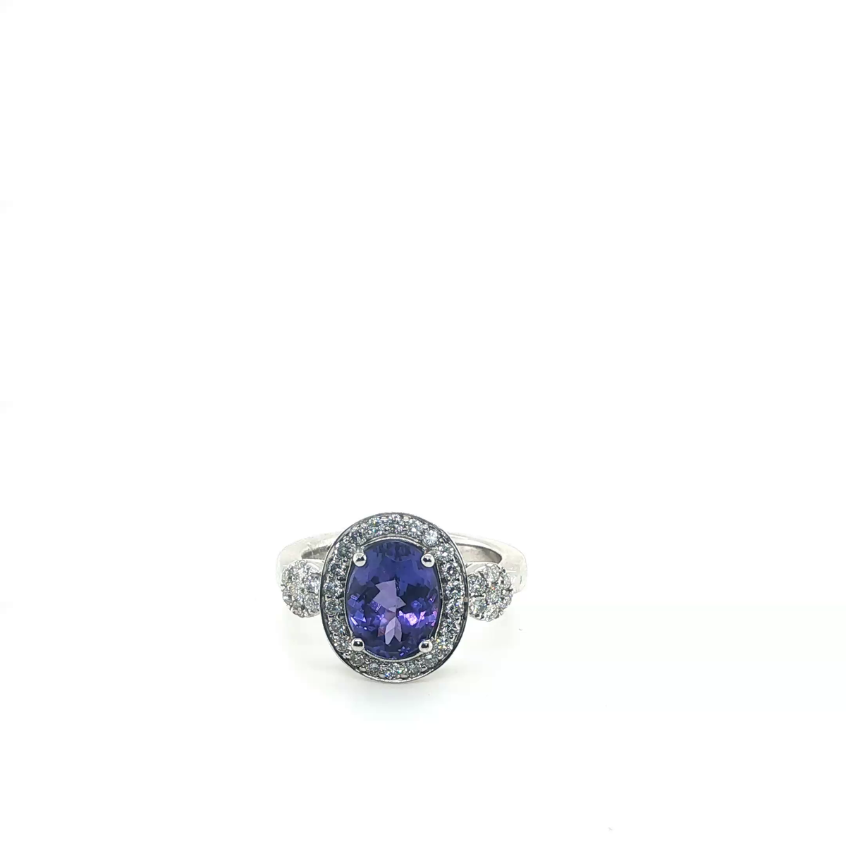 Oval Tanzanite and Diamond Halo Cluster Cocktail Ring