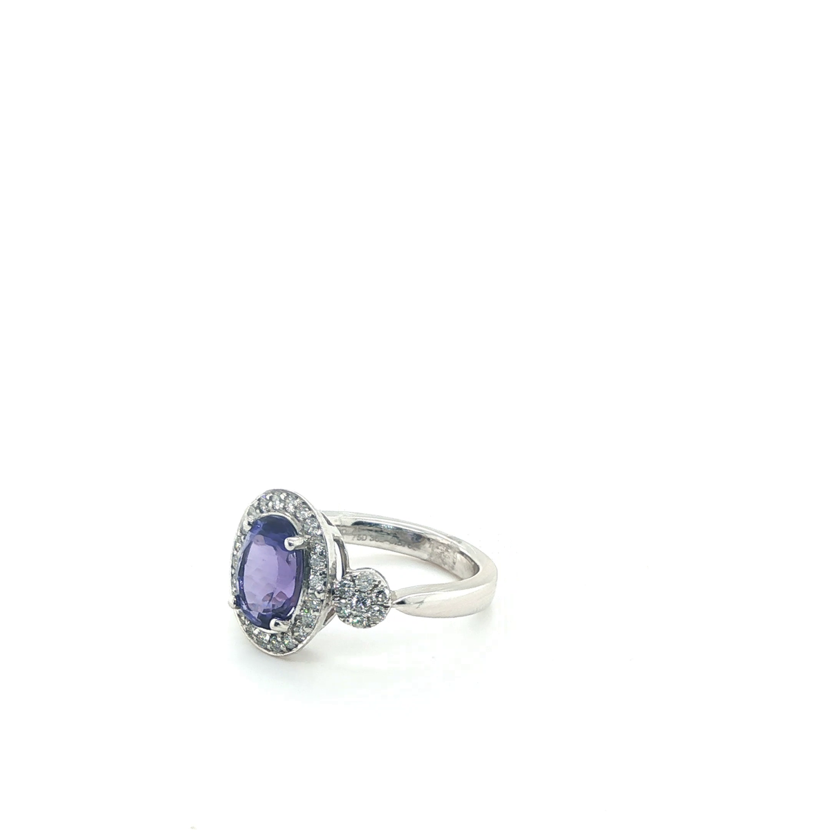 Oval Tanzanite and Diamond Halo Cluster Cocktail Ring