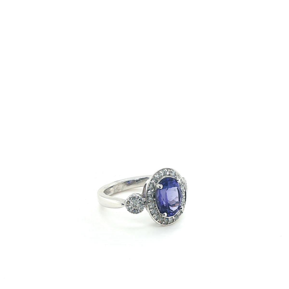 Oval Tanzanite and Diamond Halo Cluster Cocktail Ring