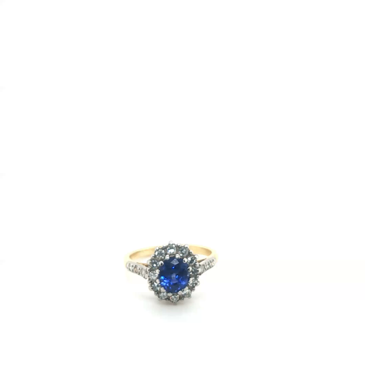 Oval Blue Sapphire and Diamond Cluster Halo Ring in Yellow Gold