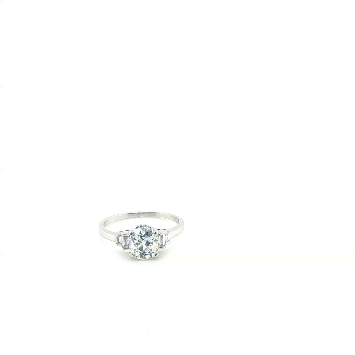 Round Brilliant Diamond Engagement Ring with Baguette Side Stones in White Gold