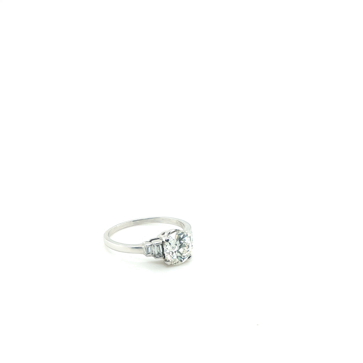 Round Brilliant Diamond Engagement Ring with Baguette Side Stones in White Gold