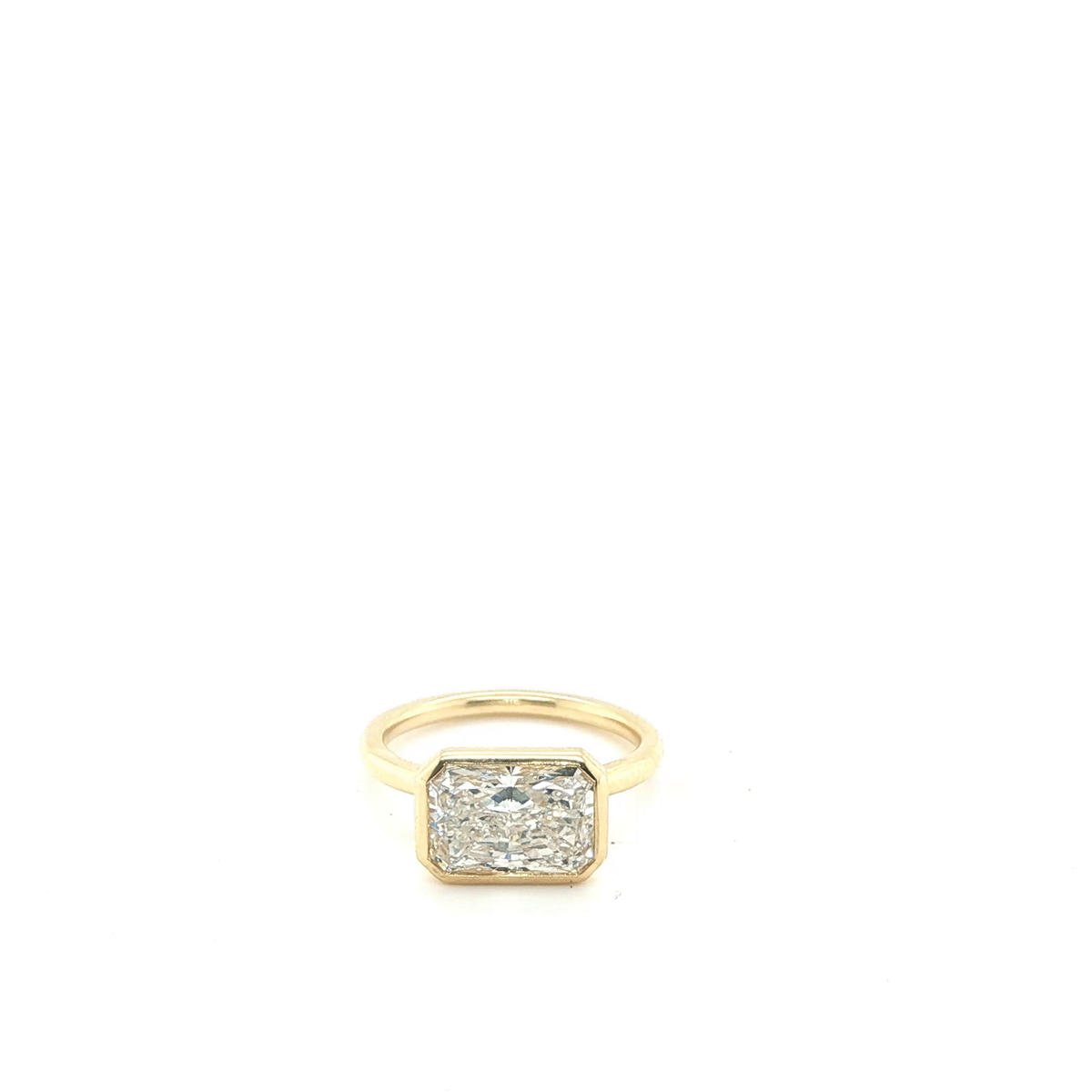 East-West Emerald Cut Lab-Grown Diamond Bezel Solitaire Ring in Yellow Gold