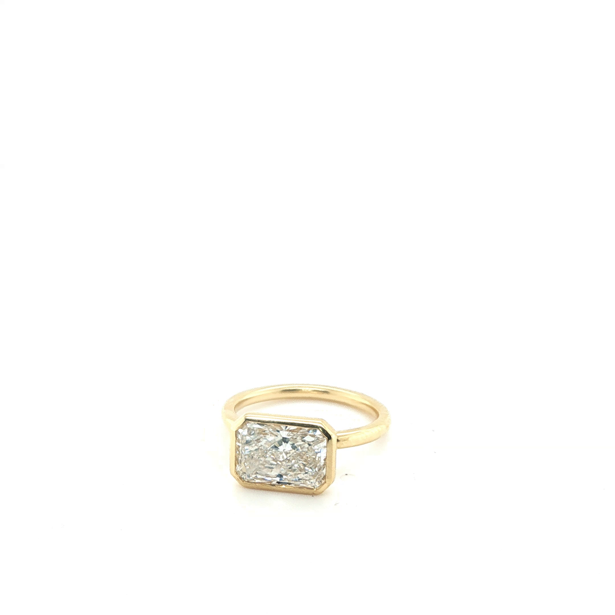 East-West Emerald Cut Lab-Grown Diamond Bezel Solitaire Ring in Yellow Gold