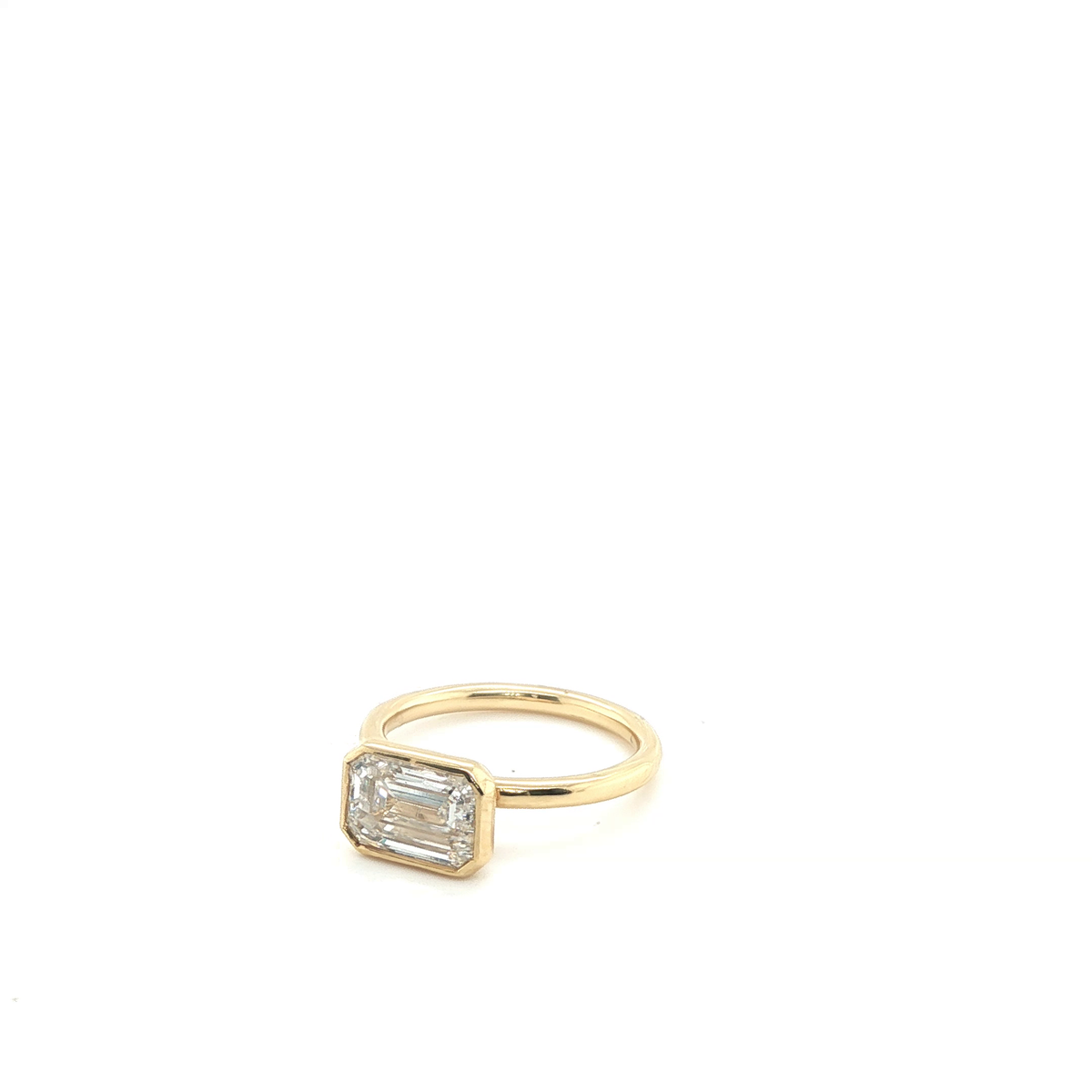 Emerald Cut Lab-Grown Diamond Bezel Solitaire Ring in Yellow Gold