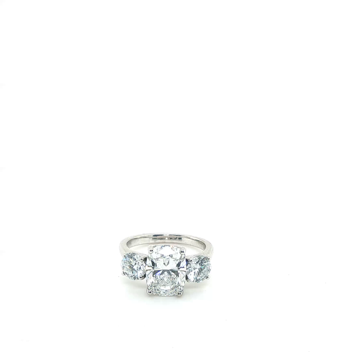 Cushion Cut and Round Brilliant Lab-Grown Diamond Three-Stone Ring in Platinum