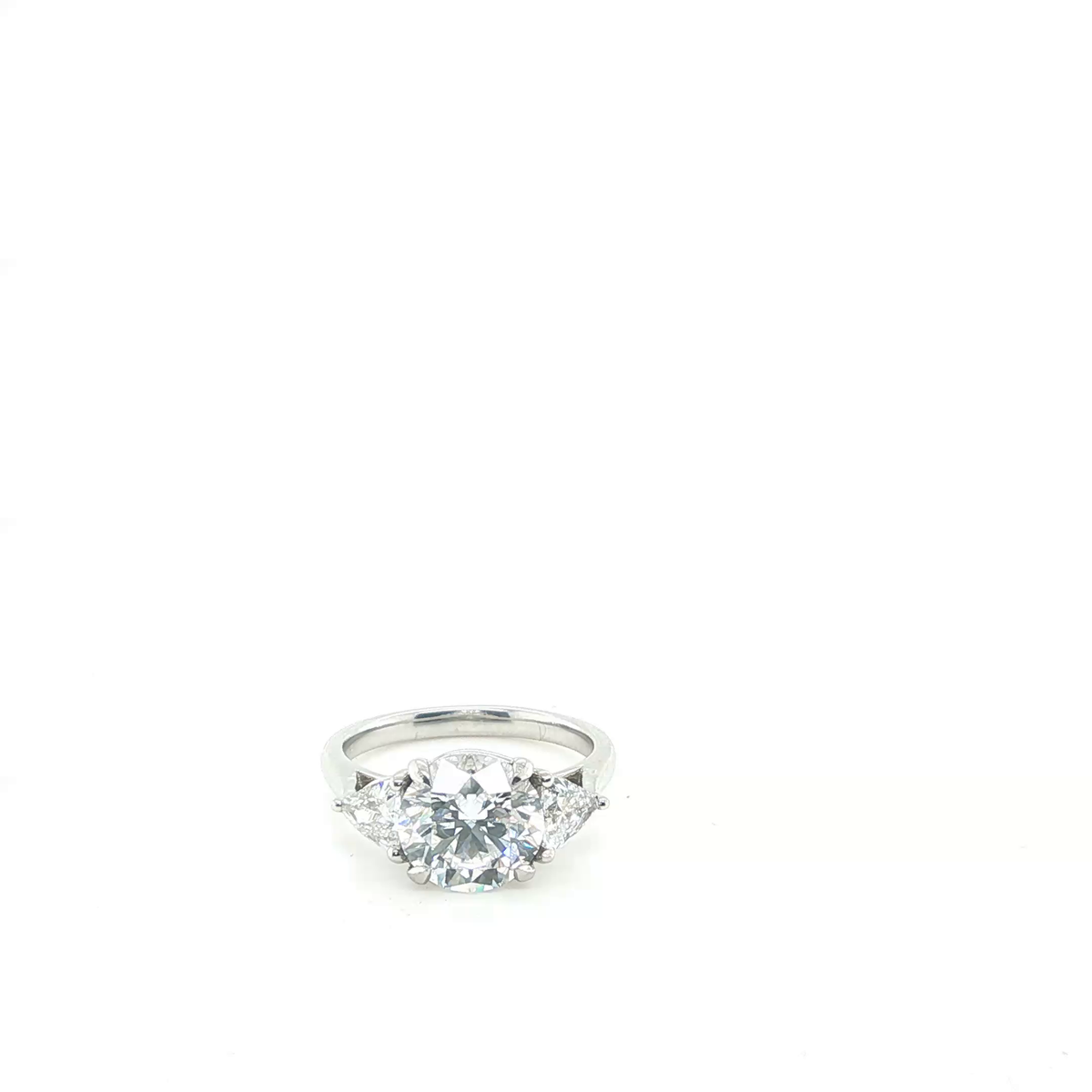 Round Brilliant and Pear Cut Lab-Grown Diamond Trilogy Engagement Ring in Platinum