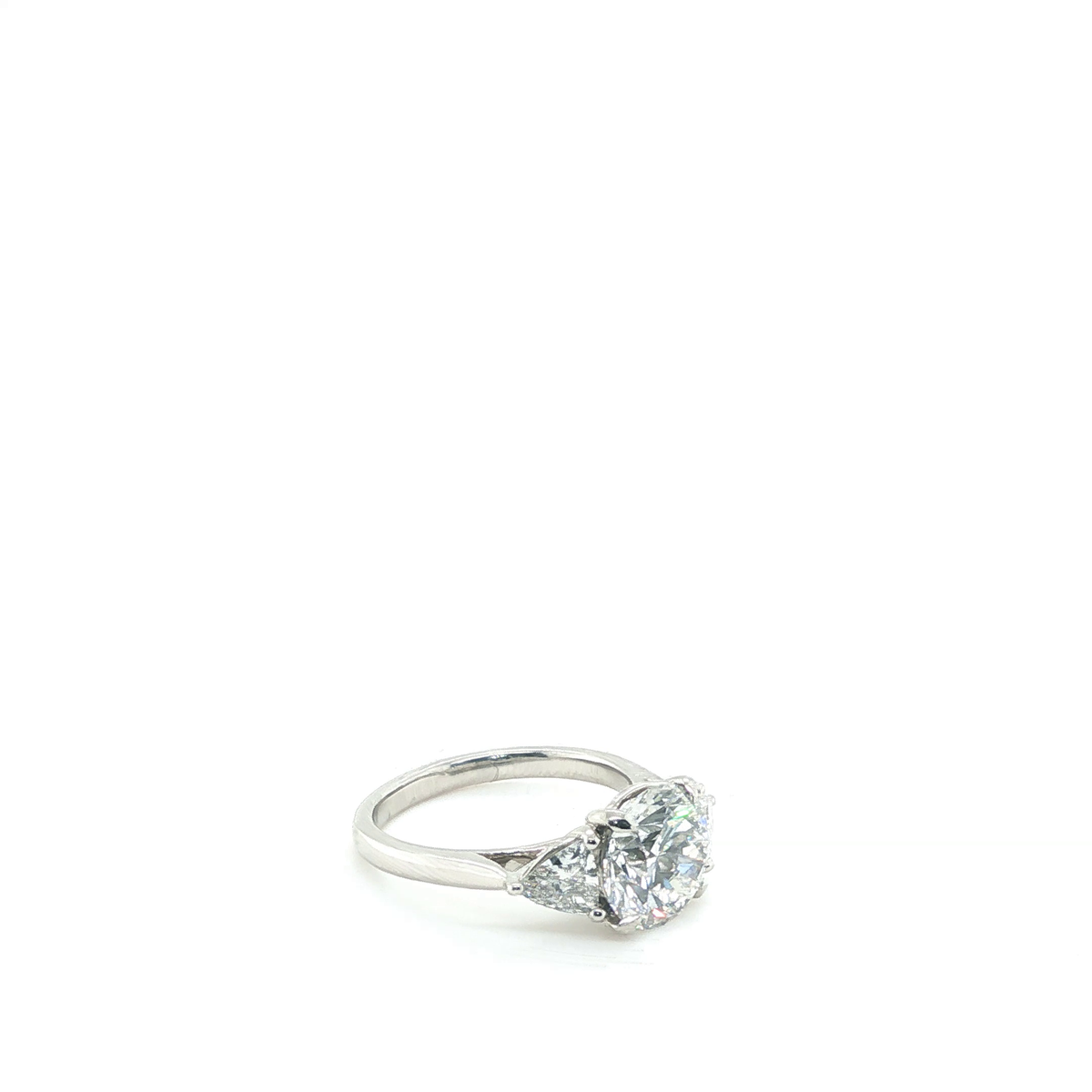 Round Brilliant and Pear Cut Lab-Grown Diamond Trilogy Engagement Ring in Platinum