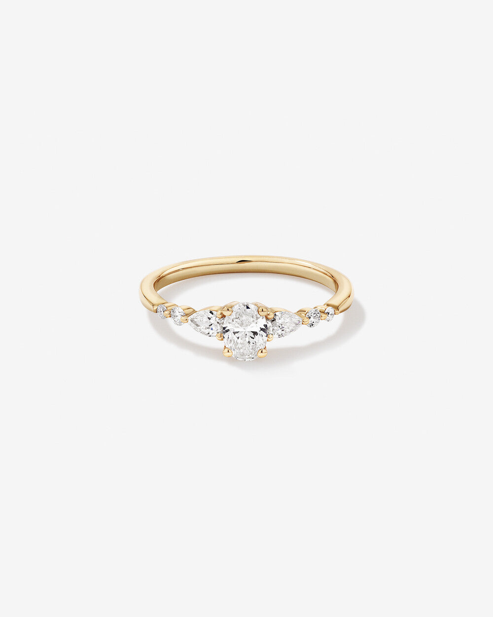 1.4 Carat Oval and Pear Sidestone Engagement Ring in 14kt Yellow Gold