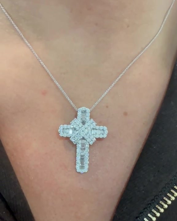 Natural diamond baguette and round brilliant cross pendant in 9ct white gold, worn