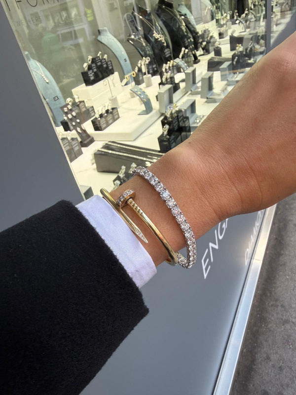 Natural diamond tennis bracelet in 18ct white gold, worn