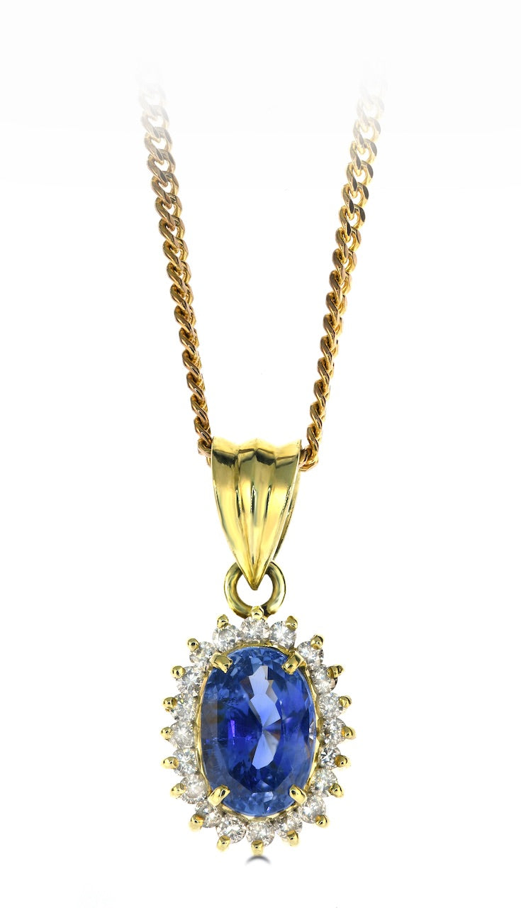 Oval Sapphire Pendant with a Diamond Halo